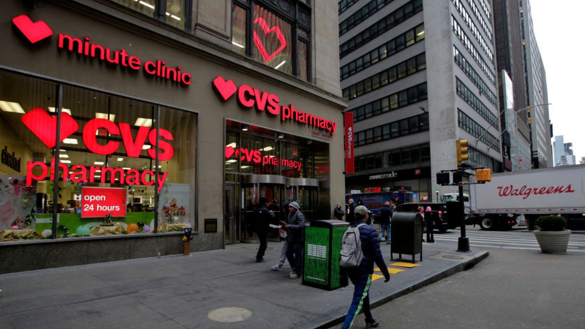 An image of a CVS Pharmacy storefront with large red CVS logos and the words "minute clinic" and "open 24 hours" visible on the windows